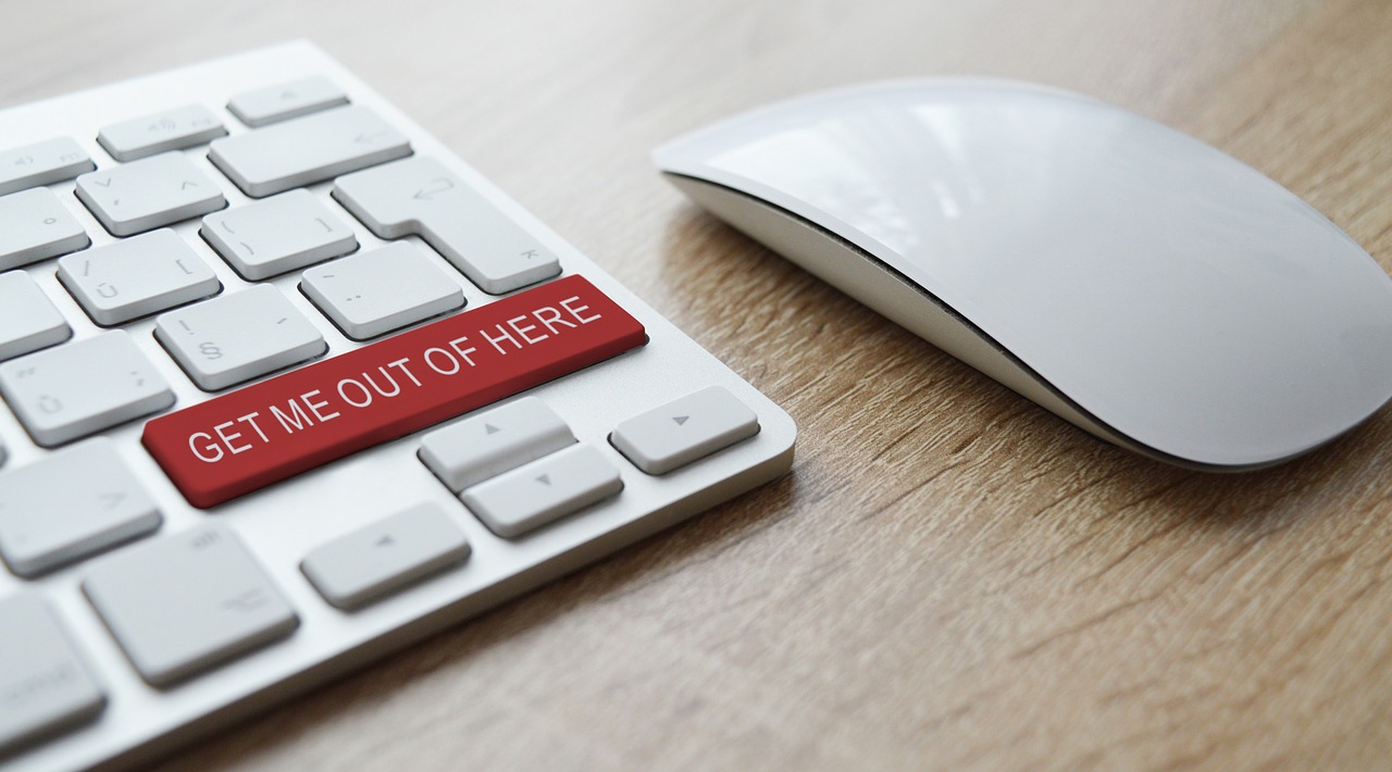 A picture of a computer keyboard with the words "get me out of here" on a red button. Used to signify the tru cost of a so called free website design to your Tyne and Wear organisiation 